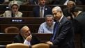 Israel's Prime Minister Benjamin Netanyahu (R) speaks with Aryeh Deri (L), chairman of the ultra-Orthodox party Shas, during a parliament session in Jerusalem on July 24, 2023, amid a months-long wave of protests against the government's planned judicial overhaul. Israeli lawmakers on July 24 prepared for a final vote on a major component of the hard-right government's controversial judicial reforms even as US President Joe Biden called for postponing the 