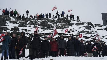 People wave Greenlandic flags as they take part in a demonstration that gathered almost a third of the city population to protest against the US President's plans to take Greenland, on January 17, 2026 in Nuuk, Greenland. US President Donald Trump escalated his quest to acquire Greenland, threatening multiple European nations with tariffs of up to 25 percent until his purchase of the Danish territory is achieved. Trump's threats came as thousands of people protested in the capital of Greenland against his wish to acquire the mineral-rich island at the gateway to the Arctic.
Alessandro RAMPAZZO / AFP