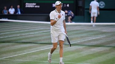 Italy's Jannik Sinner celebrates winning a point against Germany's Alexander Zverev during their men's singles final tennis match on the fourteenth day of the 2026 Wimbledon Championships at The All England Lawn Tennis and Croquet Club in Wimbledon, southwest London, on July 12, 2026. 
Henry NICHOLLS / AFP