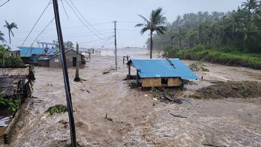 This handout photo taken on November 9, 2025 and released by the Pandan Municipal Disaster Risk Reduction and Management Office (PANDAN-MDRRMO) shows houses amid surging floodwaters as Super Typhoon Fung-wong hit the coast in Pandan, Catanduanes province. 

Handout / Pandan Municipal Disaster Risk Reduction and Management Office / AFP