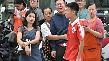 People gather outside a school following a shooting in Bang Kruai district, Nonthaburi province, north of Thailand's capital Bangkok, on August 7, 2026. Two people were killed and 15 wounded in a school shooting in a province just north of the Thai capital Bangkok on August 7, local media reported.
Lillian SUWANRUMPHA / AFP