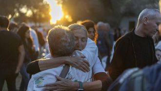 Israelis embrace each other while attending a tribute ceremony at the Kibbutz Kfar Aza, in southern Israel on October 7, 2026. Israel marks the third anniversary of Hamas's October 7, 2023 attack, just weeks before an election in which the deadliest day in the country's history will be front and centre. At 06:29 am (0329 GMT), the exact time the Hamas attack began three years ago, a tribute was held at Kibbutz Kfar Aza near the Gaza border, where militants killed 64 residents and abducted 18 people during their attack.
Ilia YEFIMOVICH / AFP