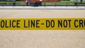 Een lint met 'police line - do not cross'.