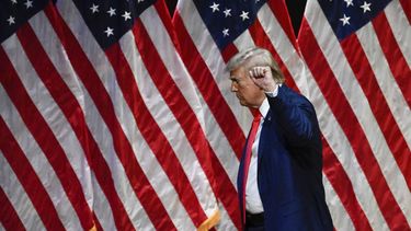 Former US President and Republican presidential candidate Donald Trump raises his fist as he leaves after speaking during a campaign rally at Harrah's Cherokee Center in Asheville, North Carolina, August 14, 2024. 
Peter Zay / AFP