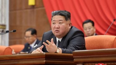 This undated picture released by North Korea's official Korean Central News Agency (KCNA) on December 12, 2025 shows North Korean leader Kim Jong Un (front) attending the 13th Plenary Meeting of the Eighth Central Committee of the Workers' Party of Korea at an unconfirmed location in North Korea. 
STR / KCNA VIA KNS / AFP