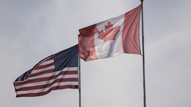 The US and Canadian flags are pictured at Peace Arch Historical State Park in Blaine, Washington, on March 5, 2025. The United States will allow a one-month exemption from tariffs on auto imports from Canada and Mexico, the White House said on March 5, a day after steep levies on its neighbors came into effect.
Jason Redmond / AFP