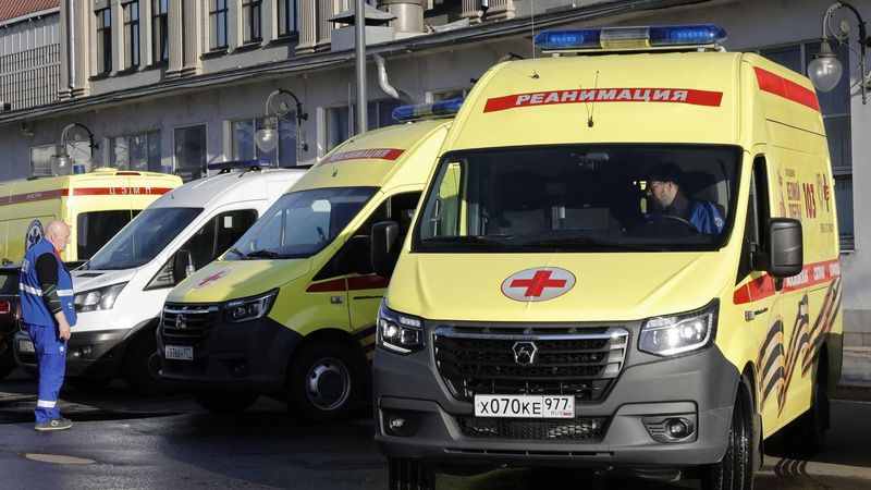A Russian medic stands next to ambulances parked at Kievsky railway station in Moscow on June 1, 2025, as they wait for the arrival of injured passengers following a bridge collapse in the Bryansk region. At least seven people were killed late on May 31, 2025 and dozens injured after a bridge collapsed onto a railway in a Russian region bordering Ukraine, officials said, in an incident the railway operator blamed on 
