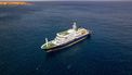 This aerial picture shows a general view of the cruise ship MV Hondius stationary off the port of Praia, the capital of Cape Verde, on May 3, 2026. An outbreak of 