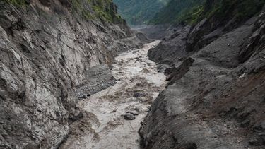 An aerial view shows a torrent of muddy water surging through the Trishuli River in the aftermath of flash floods, near the Nepal-China border at Syabrubesi village in Nepal's Rasuwa district on August 31, 2026. At least 4,471 people were listed as missing on August 31, with a further 955 confirmed dead, after the flash floods and landslides that hit the Nepal border.
Prabin Ranabhat / AFP
