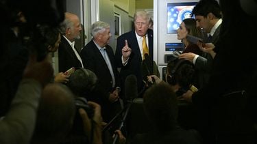 US President Donald Trump (C-R), accompanied by US senator Lindsey Graham, Republican of South Carolina, speaks with reporters aboard Air Force One on his way back to Washington, DC, on January 4, 2026. President Trump is returning to DC after spending the holidays at his Mar-a-Lago residence in Palm Beach, Florida.
Jim WATSON / AFP