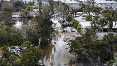 In this aerial photo, a flooded street with debris in the aftermath of Hurricane Milton, in Siesta Key, Florida, on October 10, 2024. At least 10 people were dead after Hurricane Milton smashed into Florida, US authorities said October 10, 2024, after the monster weather system sent tornados spinning across the state and flooded swaths of the Tampa Bay area.
CHANDAN KHANNA / AFP