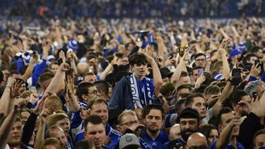 2022-05-07 23:31:48 Schalke's supporters celebrate the victory of their team on the pitch after the German second division Bundesliga football match between FC Schalke 04 vs St. Pauli in Gelsenkirchen, western Germany on May 7, 2022.  
INA FASSBENDER / AFP
