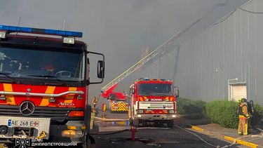This handout photograph taken and released by the Ukrainian State Emergency Service on August 21, 2026 shows firefighters taking part in operations against a fire at the site of a shopping mall damaged following a Russian strike in Kryvyi Rih amid the Russian invasion of Ukraine. Ukrainian President on August 21, 2026, blasted Russia for a 