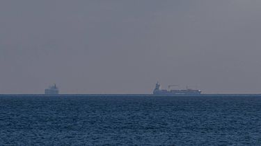 Two ships sail near the sea port of Odesa on February 19, 2026.on February 19, 2026. The main gateway to the Black Sea and beyond, Odesa is a key logistics hub for Ukraine, one of the world's top agricultural exporters. Russia has intensified its attacks on the region - tripling the number of missile and drone strikes over the last year in what officials call an attempt to cut Ukraine off from the sea.
Oleksandr GIMANOV / AFP