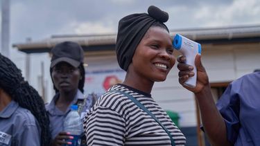 epaselect epa13150338 A woman has her temperature checked at the newly inaugurated Ebola treatment centre in Rwakole, Bunia, Democratic Republic of the Congo, 04 August 2026. The centre has a capacity of 100 beds. According to the World Health Organization (WHO), 3,605 confirmed Ebola cases, including 1,587 deaths, had been reported in the country as of 30 July.  EPA/DIEUDONNE DIROLE