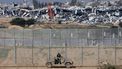 A picture taken from a position in southern Israel along the border with the Gaza Strip on January 19, 2024, shows an Israeli army vehicle driving along the fence in Israel amid continuing battles between Israel and the militant group Hamas. 
JACK GUEZ / AFP