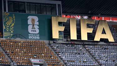 A FIFA logo is pictured on the stands as South Africa's players take part in a pitch recognition at the Mexico City Stadium in Mexico City on June 10, 2026, on the eve of the 2026 World Cup football match between Mexico and South Africa. 
Alfredo ESTRELLA / AFP