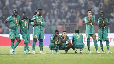 Senegal's players react as they stand next to the penalty spot during the extra time of the Africa Cup of Nations (CAN) 2024 round of 16 football match between Senegal and Ivory Coast at the Stade Charles Konan Banny in Yamoussoukro on January 29, 2024. 
KENZO TRIBOUILLARD / AFP