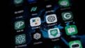 This illustration picture shows icons of Google's AI (Artificial Intelligence) app BardAI (or ChatBot) (C-L), OpenAI's app ChatGPT (C-R) and other AI apps on a smartphone screen in Oslo, on July 12, 2023. 
OLIVIER MORIN / AFP