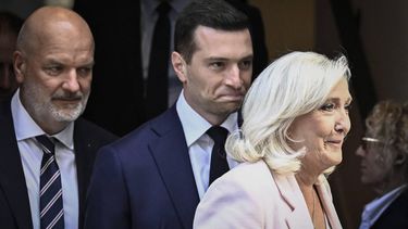 French far-right party Rassemblement National (RN) president Jordan Bardella (C) and President of Rassemblement National parliamentary group Marine Le Pen (R) leave the party's new headquarters following a meeting, after the Paris Court of Appeal delivered its verdict in the trial of former and current RN members charged with embezzling European public funds in an alleged case of fake jobs at the European Parliament in Paris on 7 July 2026. An appeals court on July 7, 2026, handed France's far-right chief Marine Le Pen a one-year term with an ankle tag over a fake jobs scam in the European parliament, casting doubt on whether she will run for president next April. The court also prevented her from running for office for 15 months, a ban expected to have expired this year.
JULIEN DE ROSA / AFP