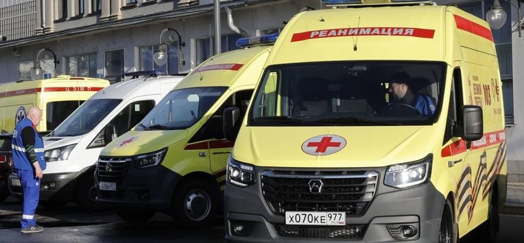 A Russian medic stands next to ambulances parked at Kievsky railway station in Moscow on June 1, 2025, as they wait for the arrival of injured passengers following a bridge collapse in the Bryansk region. At least seven people were killed late on May 31, 2025 and dozens injured after a bridge collapsed onto a railway in a Russian region bordering Ukraine, officials said, in an incident the railway operator blamed on 