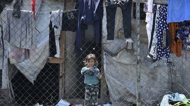 epaselect epa10705995 A Syrian refugee child stands outside a makeshift shelter during a visit of a delegation of Members of the European Parliament to the Syrian refugee camp in Marj area at Bekaa Valley, Lebanon, 22 June 2023. The delegation's visit comes after a lot of controversy over the presence of Syrian refugees in Lebanon and calls by various Lebanese parties and politicians to return refugees to Syria or to transfer them to another country. The Lebanese Government estimates that Lebanon currently hosts approximately 1.5 million refugees from Syria, including approximately 815,000 registered with UNHCR.  EPA/WAEL HAMZEH