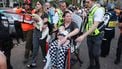 Responders attend to a woman and a baby near a damaged building following a strike by an Iranian missile in the Israeli city of Petah Tikva, east of Tel Aviv, on June 16, 2025. Israel's military warned on June 16 of a new missile salvo incoming from Iran, as AFP journalists reported loud explosions in Jerusalem and fires outside the coastal city of Haifa. 