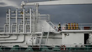 A crew member walks on the deck of an oil and chemical tanker, moored on the Garonne river at a petroleum depot in Ambes, near Bordeaux, south-western France, on May 5, 2026. The Strait of Hormuz has been largely blocked since February 28, 2026, when the United States and Israel launched coordinated airstrikes on Iran, with the waterway previously accounting for roughly 20% of the world's seaborne oil trade. 
Philippe LOPEZ / AFP