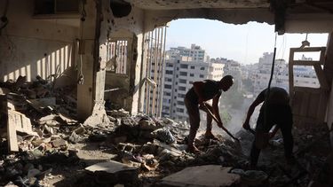 Palestinian residential salvage what they can from an apartment targeted in overnight Israeli airstrikes in Gaza City on August 2, 2026. Overnight Israeli strikes on Gaza hit multiple residential buildings and killed at least eight people, authorities said August 2, despite Hamas saying it agreed to the latest stage of a deal to end the war. In one attack near the central Gaza Strip, a man and his wife were killed and several others were wounded when an Israeli military helicopter struck an apartment, a civil defence spokesman said. An elderly man and a child were killed in another attack on an apartment west of Gaza City, and three people, including a child, were targeted when a strike hit another apartment northwest of Khan Younis in the southern Gaza Strip.

Omar AL-QATTAA / AFP