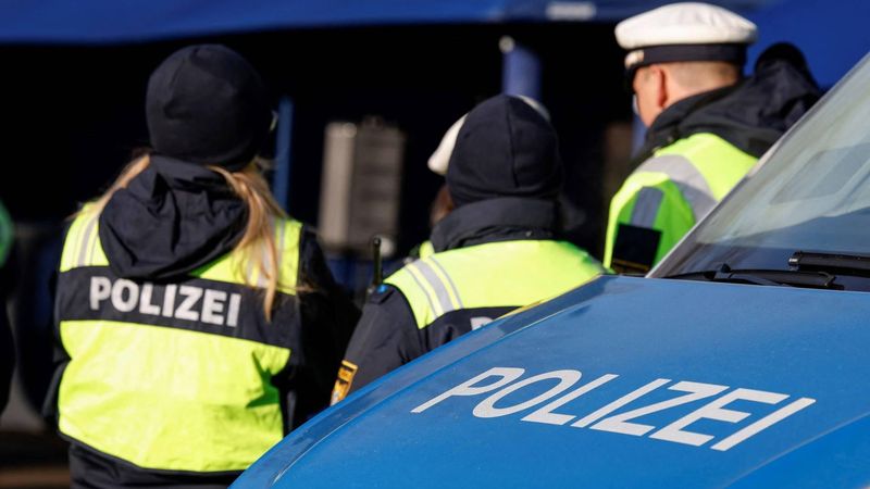 The lettering 'Polizei' (police) is seen on the bonnet of a police vehicle as German police officers control cars at a border control station between Oberaudorf (Germany) and Niederndorf (Austria), southern Germany on February 6, 2025. 
Michaela STACHE / AFP