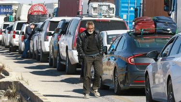 Trucks and people wait to cross into Syria through the Jaber-Nassib border crossing after the Jordanian government allowed for the transport of goods to resume, on December 19, 2024. Islamist-led rebels took Damascus in a lightning offensive on December 8, ousting president Bashar al-Assad and ending five decades of Baath rule in Syria.
Khalil MAZRAAWI / AFP