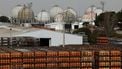 Gas bottles are seen near storage tanks at a Liquefied Petroleum Gas (LPG) factory in Pinto, near Madrid, on March 5, 2026.  Markets have been roiled much of the week as the conflict between the United States and Iran effectively closed shipping through the Strait of Hormuz, where a fifth of the world's crude oil travels as well as considerable liquefied natural gas (LNG) supplies travel through.
Oscar DEL POZO / AFP