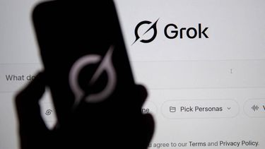 In this photo illustration, the Grok website is seen on a computer screen next to a mobile phone displaying the logo in Bogota on February 12, 2026. Brazilian authorities reported on February 12 that they had ordered billionaire Elon Musk's social network X to take immediate action to prevent the creation of sexual images generated by Grok, its artificial intelligence (AI) assistant.
Pablo VERA / AFP
