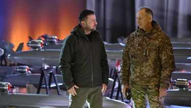Ukrainian President Volodymyr Zelensky (L) and Commander-in-Chief of the Armed Forces of Ukraine Oleksandr Syrsky (R) speak next to the first batch of Ukrainian made drone missiles 