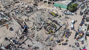This aerial view shows rescuers working on the rubble of a collapsed building in Caraballeda, La Guaira state, Venezuela, on June 28, 2026, following earthquakes. Thousands of rescuers, relatives and volunteers dig day and night through mounds of concrete to find survivors of the earthquakes that struck Venezuela more than three days ago, leaving nearly 1,500 dead and tens of thousands missing.
Miguel MEDINA / POOL / AFP