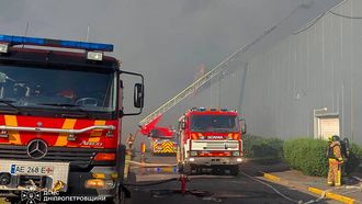 This handout photograph taken and released by the Ukrainian State Emergency Service on August 21, 2026 shows firefighters taking part in operations against a fire at the site of a shopping mall damaged following a Russian strike in Kryvyi Rih amid the Russian invasion of Ukraine. Ukrainian President on August 21, 2026, blasted Russia for a "cynical and despicable" attack on a shopping centre in his home town that killed at least five people and wounded more than 50.
Handout / State Emergency Service of Ukraine / AFP