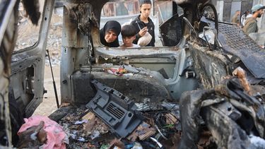 A Palestinian woman and child looks inside the destroyed vehicle targeted by the Israeli military, in Gaza City on November 22, 2025. Gaza's civil defence agency said seven people were killed in three Israeli air strikes on the Palestinian territory on November 22. A spokesman for the agency, which operates under Hamas authority, said three people were killed in a strike on a car in the Gaza City area, three were killed in another on a house in Deir al-Balah, and one was killed in a third strike in the Nuseirat area.
Omar AL-QATTAA / AFP