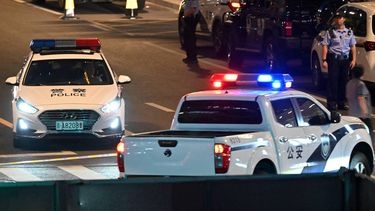 Police personnel block the road near the CITIC Tower in Beijing on June 26, 2026, after an eyewitness reported plane debris at the base of Beijing's tallest building. Video footage taken from a nearby building by the witness showed fire trucks blasting water at smoke billowing from the 528-metre (1,732-foot) CITIC Tower, while the wreck of a plane lay on the ground beside the building.
Adek BERRY / AFP