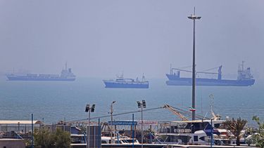 In this picture obtained from Iran's ISNA news agency on June 18, 2026, vessels are seen anchored in Bandar Abbas along the Strait of Hormuz. Oil prices tumbled after Trump and his Iranian counterpart separately signed their accord to end the Middle East war, with the Strait of Hormuz to reopen but two months of negotiations lying ahead.
AMIRHOSSEIN KHORGOOEI / ISNA / AFP