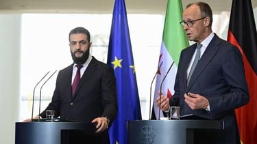 German Chancellor Friedrich Merz (R) and Syrian President Ahmed al-Sharaa address a joint press conference after talks at the Chancellery in Berlin on March 30, 2026.  Syria's President Ahmed al-Sharaa visits Germany on Monday for talks on the Middle East war, rebuilding his country and Berlin's efforts to send back Syrian refugees.
John MACDOUGALL / AFP