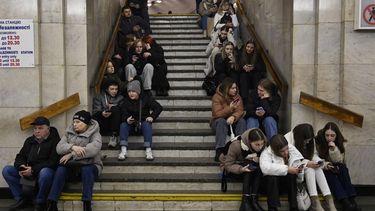 People take shelter in a subway station as they wait for the end of another air alarm after a Russian missile attack in Kyiv, on December 29, 2023. Russia launched drone and missile strikes across Ukraine on December 29, in one of the biggest air attacks of the war.
Sergei CHUZAVKOV / AFP
