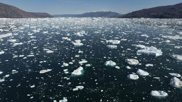 This photograph taken on August 15, 2023, shows water melting from an iceberg in Scoresby Fjord, Greenland.  The French National Centre for Scientific Research (CNRS) is undertaking an expedition to explore Greenland's isolated fjords, the planet's largest fjord system, which remains vastly understudied. The expedition, arranged by the volunteer-run French initiative Greenlandia, is dedicated to understanding the climate change's effects on Scoresby Fjord and its inhabitants.
Olivier MORIN / AFP
