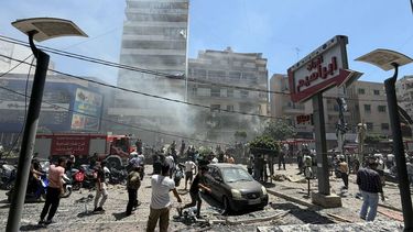 People gather at the site of an Israeli airstrike that targeted a building in Beirut’s southern suburbs on June 14, 2026. The office of Israeli Prime Minister Benjamin Netanyahu said on June 14 the military had carried out strikes in Beirut's southern suburbs, known as Dahiyeh, while Lebanese state media said a strike hit the Ghobeiry neighbourhood.
Ibrahim AMRO / AFP