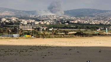 A photograph taken from the Tyre region of southern Lebanon shows two men lying on the beach as smoke rises from the site of Israeli airstrikes that targeted the village of Rmadiyeh in the Tyre district of southern Lebanon on May 26, 2026. Israel has repeatedly bombed Lebanon despite a truce in its war with Hezbollah, saying it is targeting the group, while the latter has claimed several attacks on Israeli positions in southern Lebanon and Northern Israel. Lebanese authorities say more than 3,100 people have been killed by Israeli strikes since March 2, when Hezbollah drew Lebanon into the Middle East war by attacking Israel in support of its backer Iran.

Kawnat HAJU / AFP