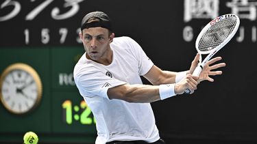 Netherlands' Tallon Griekspoor hits a return against France's Arthur Cazaux during their men's singles match on day seven of the Australian Open tennis tournament in Melbourne on January 20, 2024. 
Lillian SUWANRUMPHA / AFP