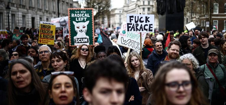 Protesters holding placards gather ahead of speeches after a march against the far right, organised by the Together Alliance, in central London on March 28, 2026. 
Henry NICHOLLS / AFP