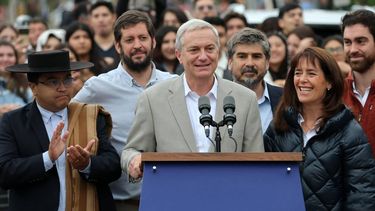 Chile's presidential candidate Jose Antonio Kast, of the Partido Republicano party, speaks next to his wife Maria Pia Adriasola (R) outside a polling station after casting his ballot during the presidential runoff election in Paine, south of Santiago, on December 14, 2025. Chileans head to the polls for a presidential runoff between Jeannette Jara, a communist backed by a broad left coalition, and Jose Antonio Kast, a devout far-right politico promising a hard line on security and migration.
Javier TORRES / AFP