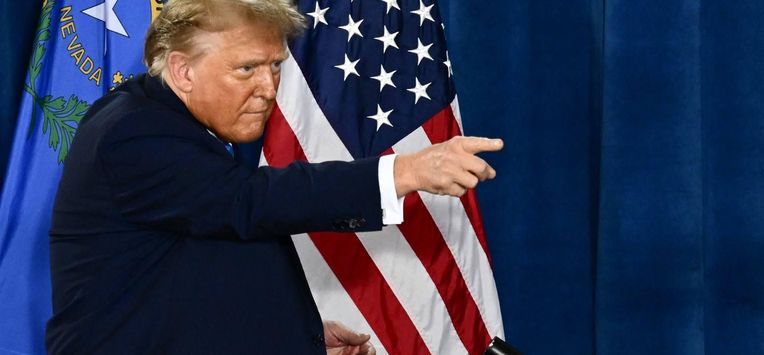 Former US President and 2024 presidential hopeful Donald Trump points after speaking at a Commit to Caucus Rally in Las Vegas, Nevada, on January 27, 2024.  
Patrick T. Fallon / AFP