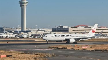 This photo taken on December 29, 2023 shows a Japan Airlines (JAL) passenger plane taxiing past the control tower after its arrival at Tokyo International Airport at Haneda in Tokyo. 
Richard A. Brooks / AFP
