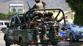 Yemen's Houthi armed forces patrol as Yemeni prisoners loyal to the Houthi authorities arrive in the capital Sanaa on September 12, 2026, after being released on the west coast where he and others were being held by Yemen's Saudi-backed government forces. Some 210 prisoners were released following a week-long offensive, in which the Iran-backed Houthis on September 11, 2026, captured Yemen's Red Sea coast from the internationally recognised government, cementing their hold on the Bab al-Mandab Strait, a vital artery for Saudi Arabian oil exports as the Strait of Hormuz remains closed amid the US-Iran war. 
Mohammed HUWAIS / AFP